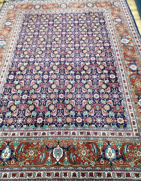 A North West Persian blue ground carpet 287 x 210cm
